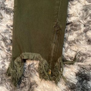 Green distressed jeans